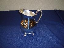 Silver pitcher with ice guard